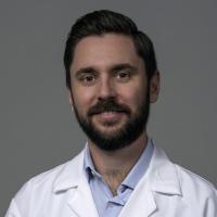 Dr. Giordano headshot in a whitecoat